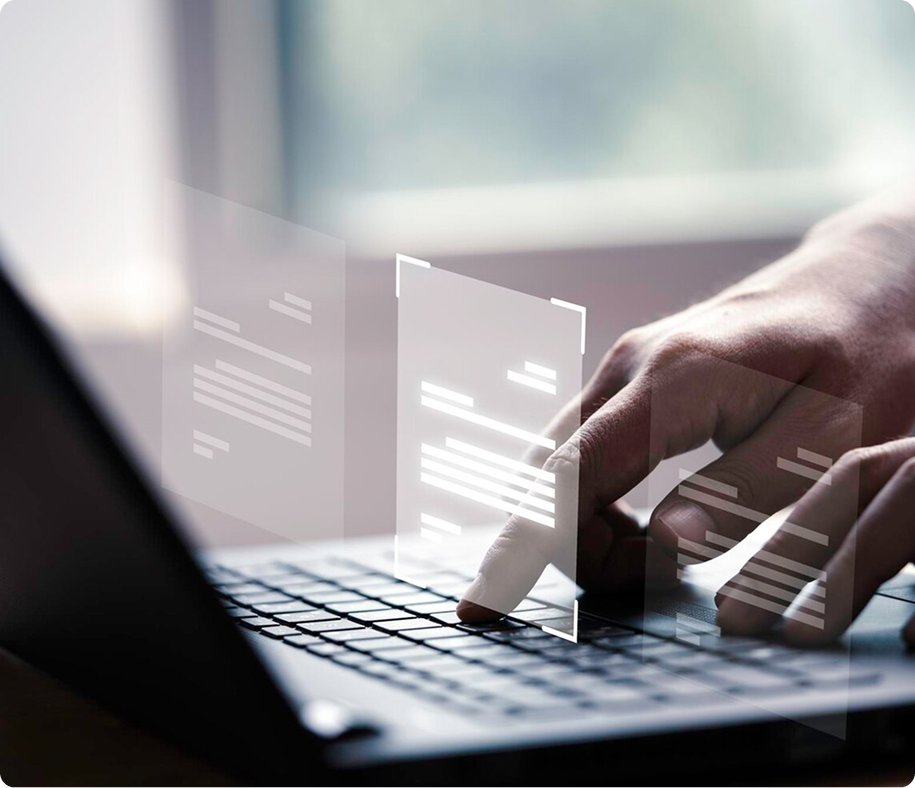Close-up of a person interacting with a laptop, with digital document interface elements hovering above the keyboard, representing virtual data management or cybersecurity.