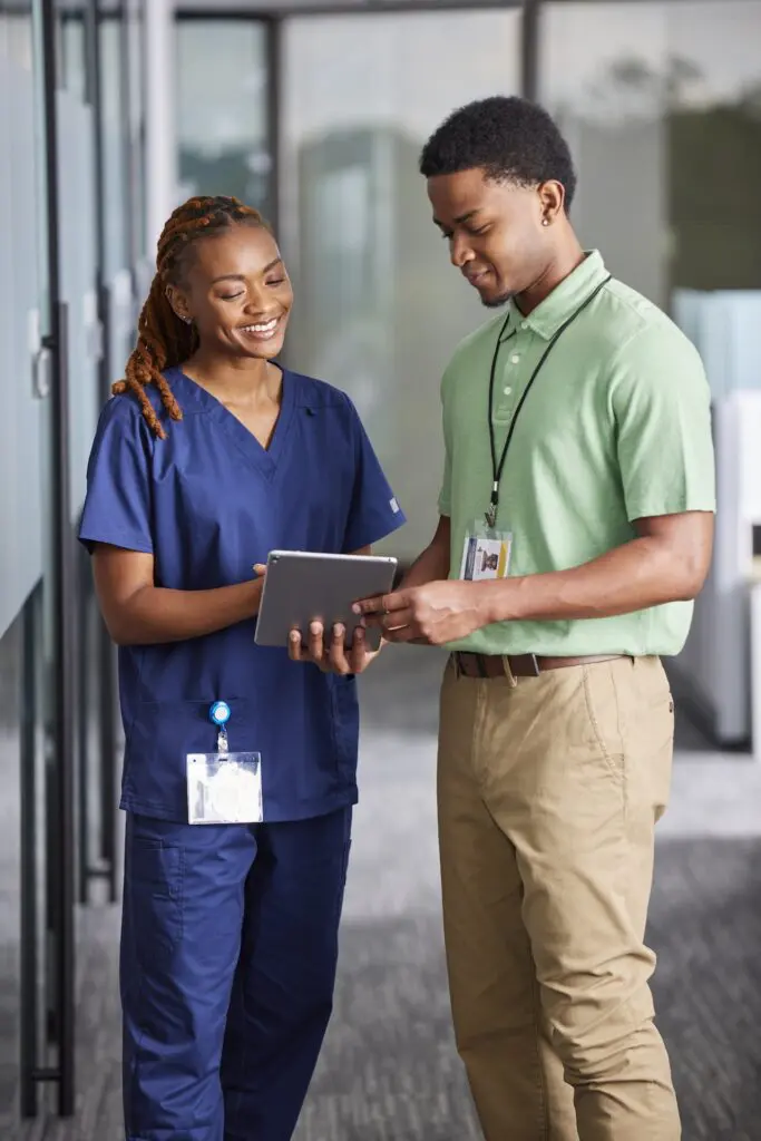 Intelas Inpatient people looking at an iPad