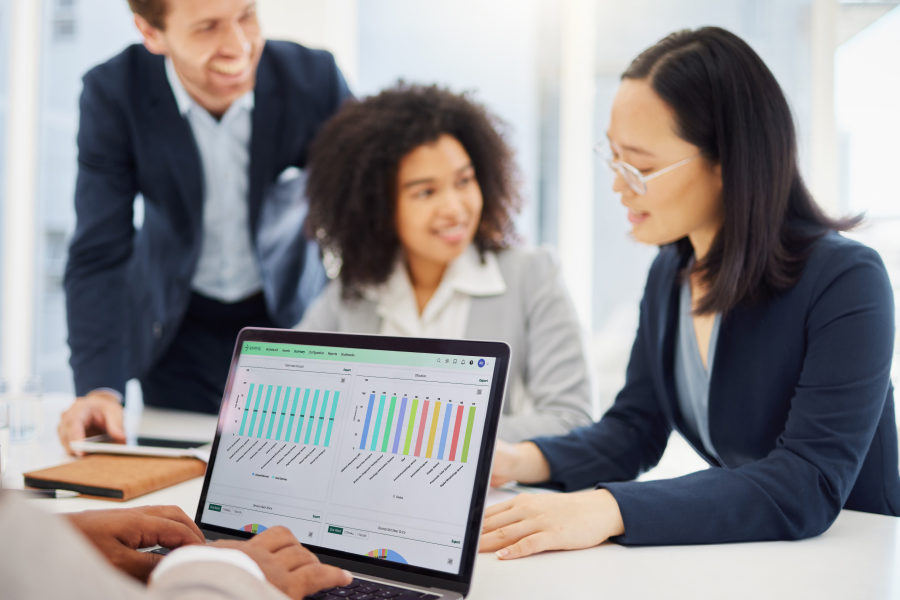 Intelas team looking at a chart