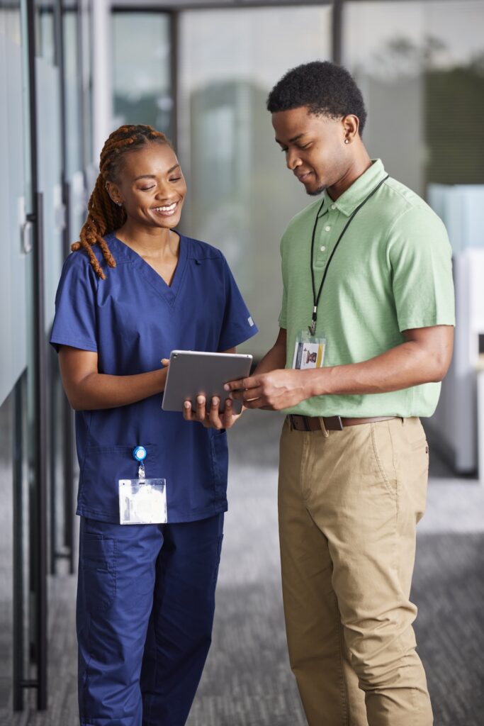 Intelas Inpatient people looking at an iPad